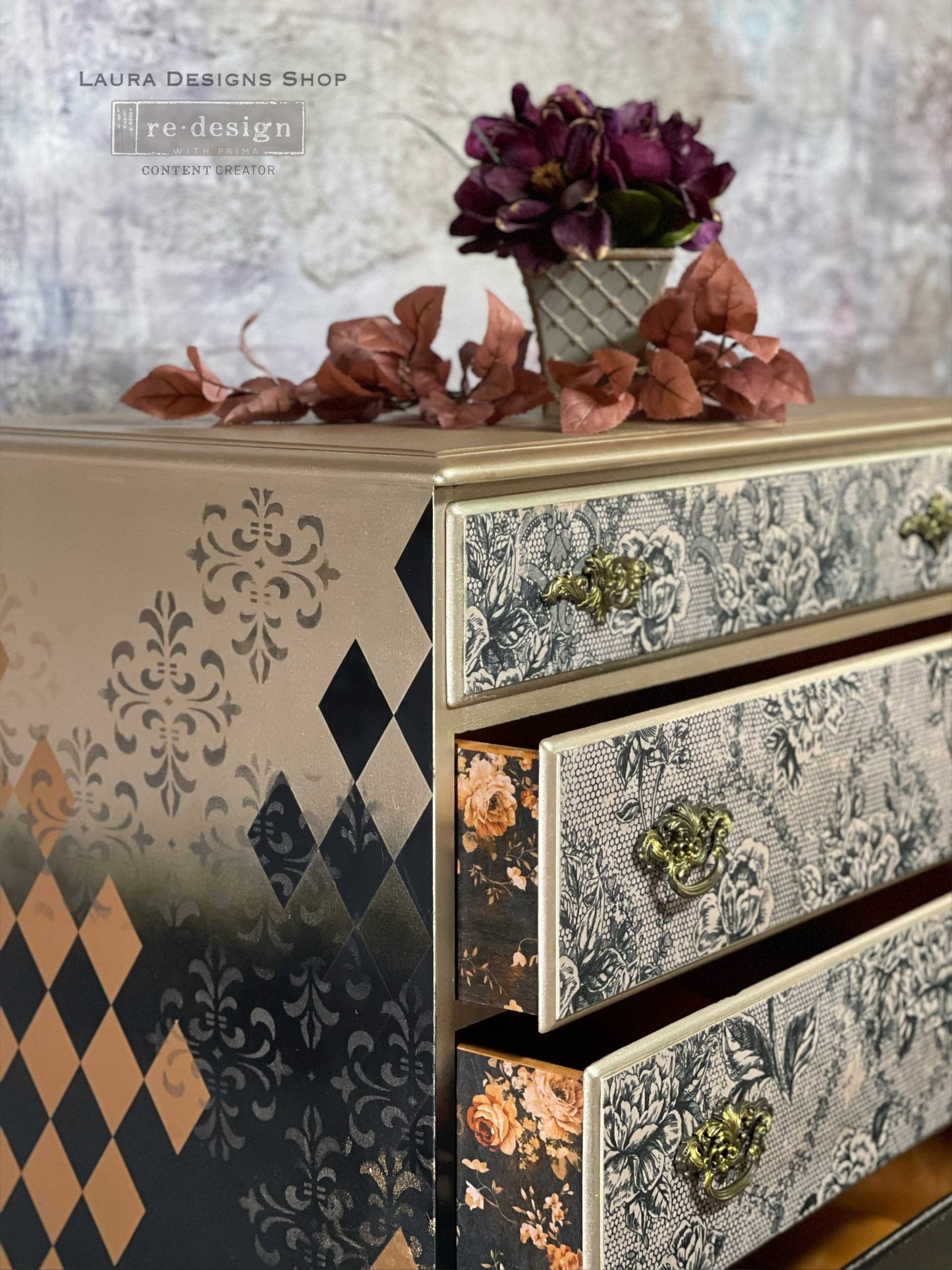 Close-up of a dresser makeover featuring Antique Laces floral decoupage on drawer fronts with gold trim, vintage hardware, and stenciled side details.