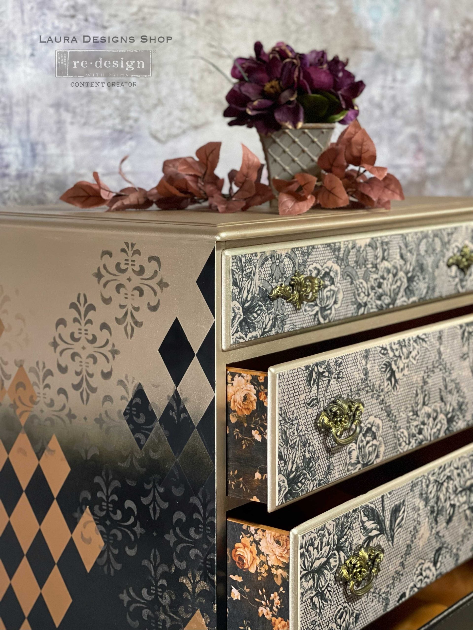 Close-up of a dresser makeover featuring Antique Laces floral decoupage on drawer fronts with gold trim, vintage hardware, and stenciled side details.