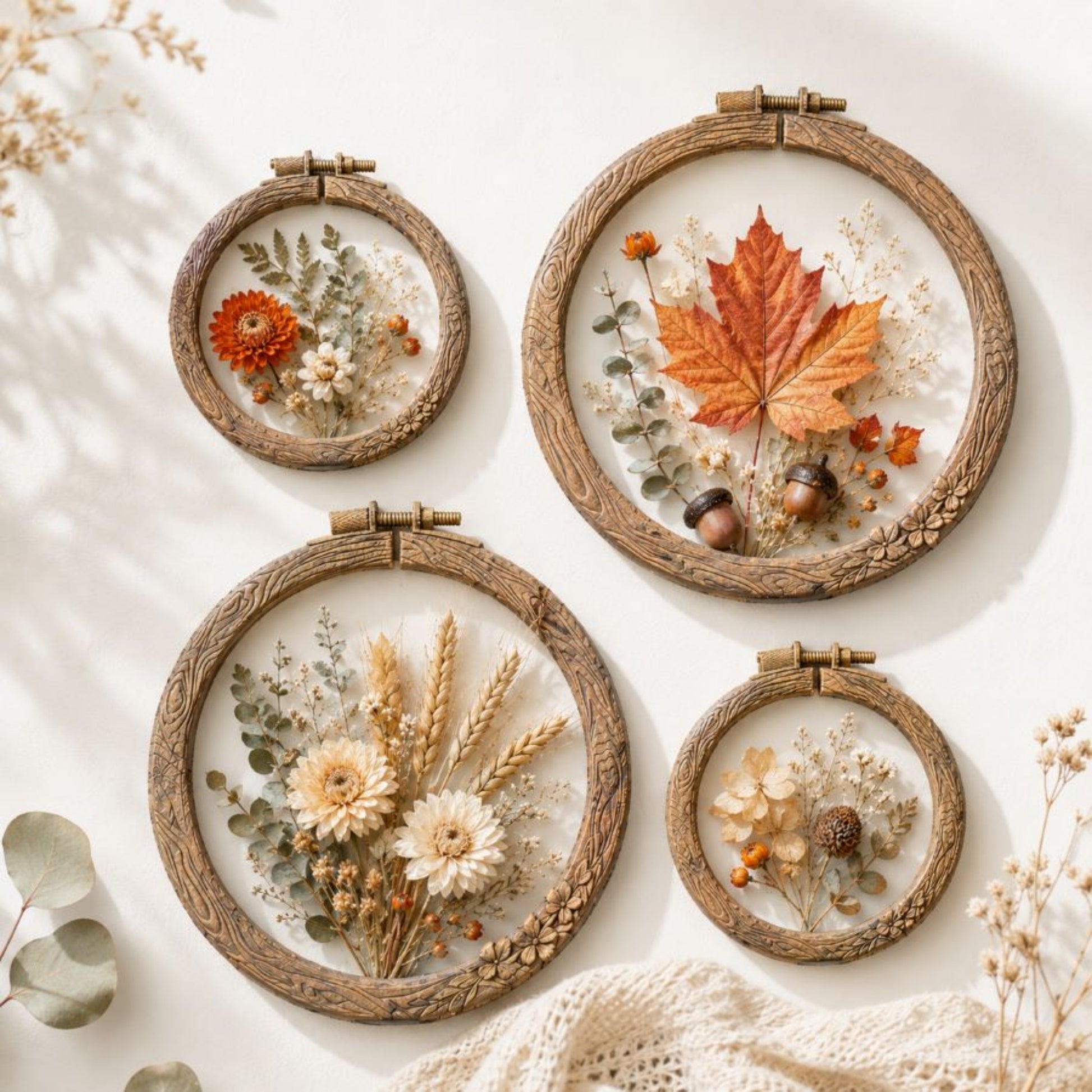 Artisan’s Frame mould castings displayed as botanical embroidery hoops with butterflies and colorful flowers.