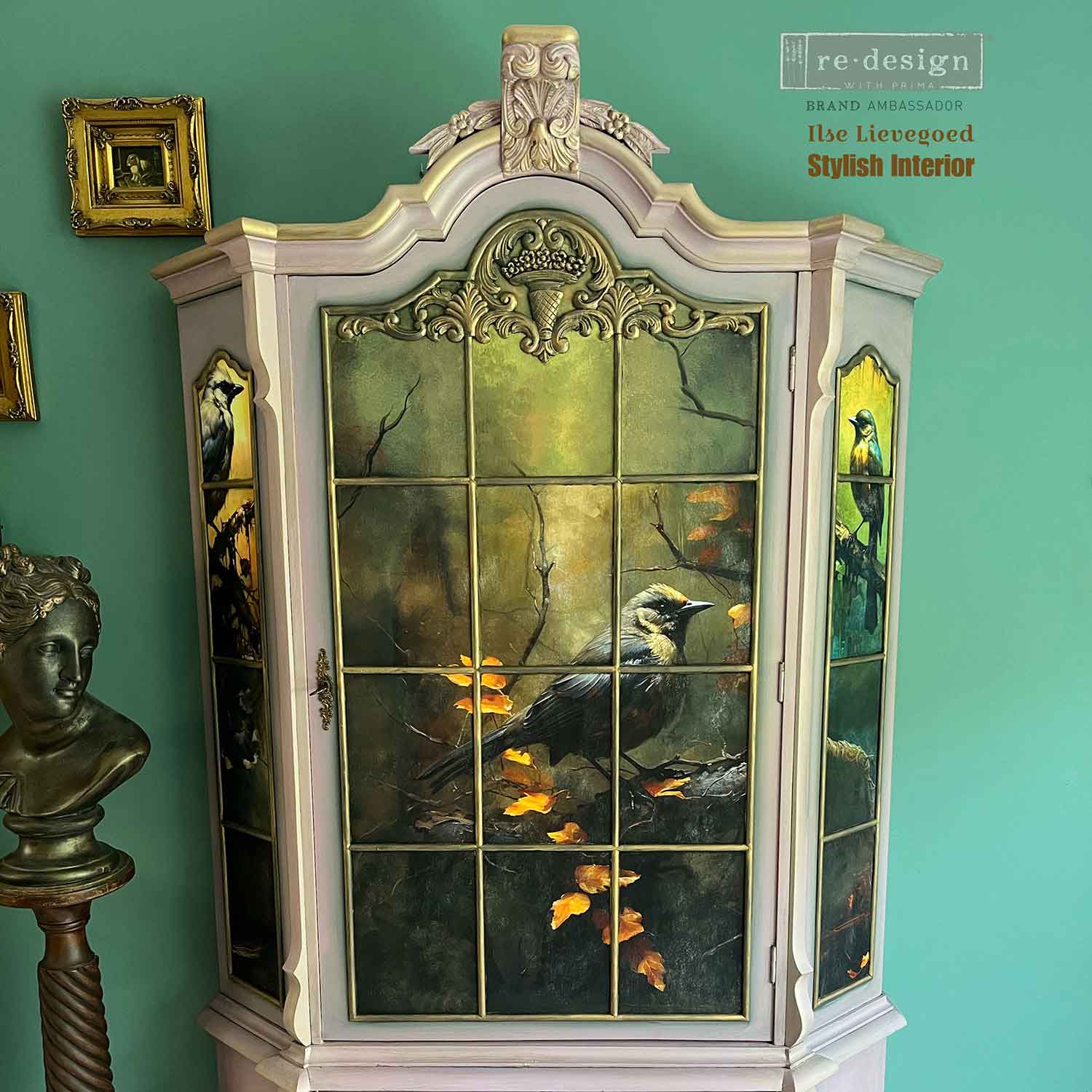 Close-up of Avian Dreamscape decoupage tissue paper on an ornate vintage cabinet, featuring a dark bird, golden leaves, and moody green and brown tones.