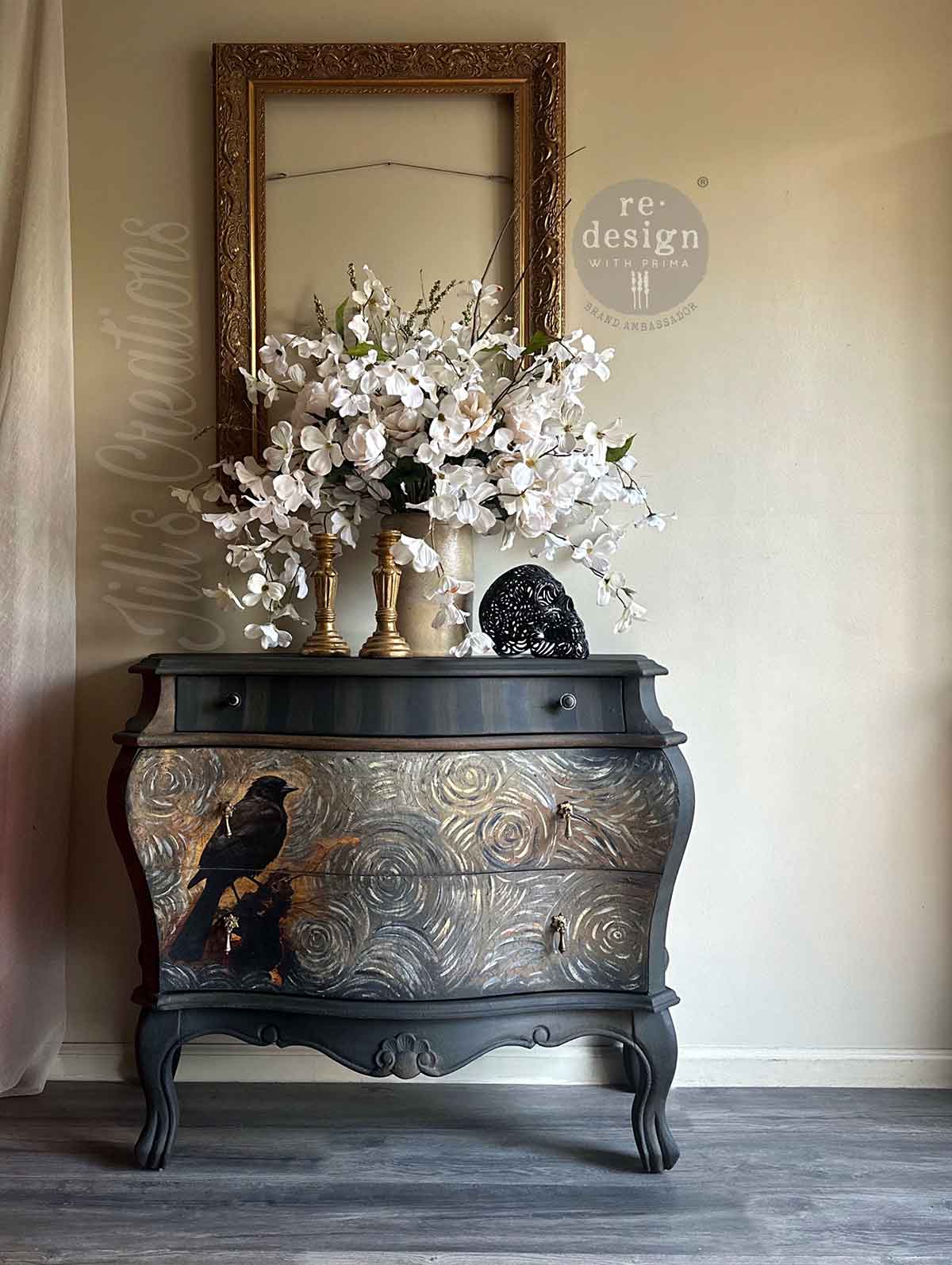 Avian Dreamscape decoupage tissue paper applied to a dark vintage bombe dresser, featuring a black bird against a textured metallic and artistic background.