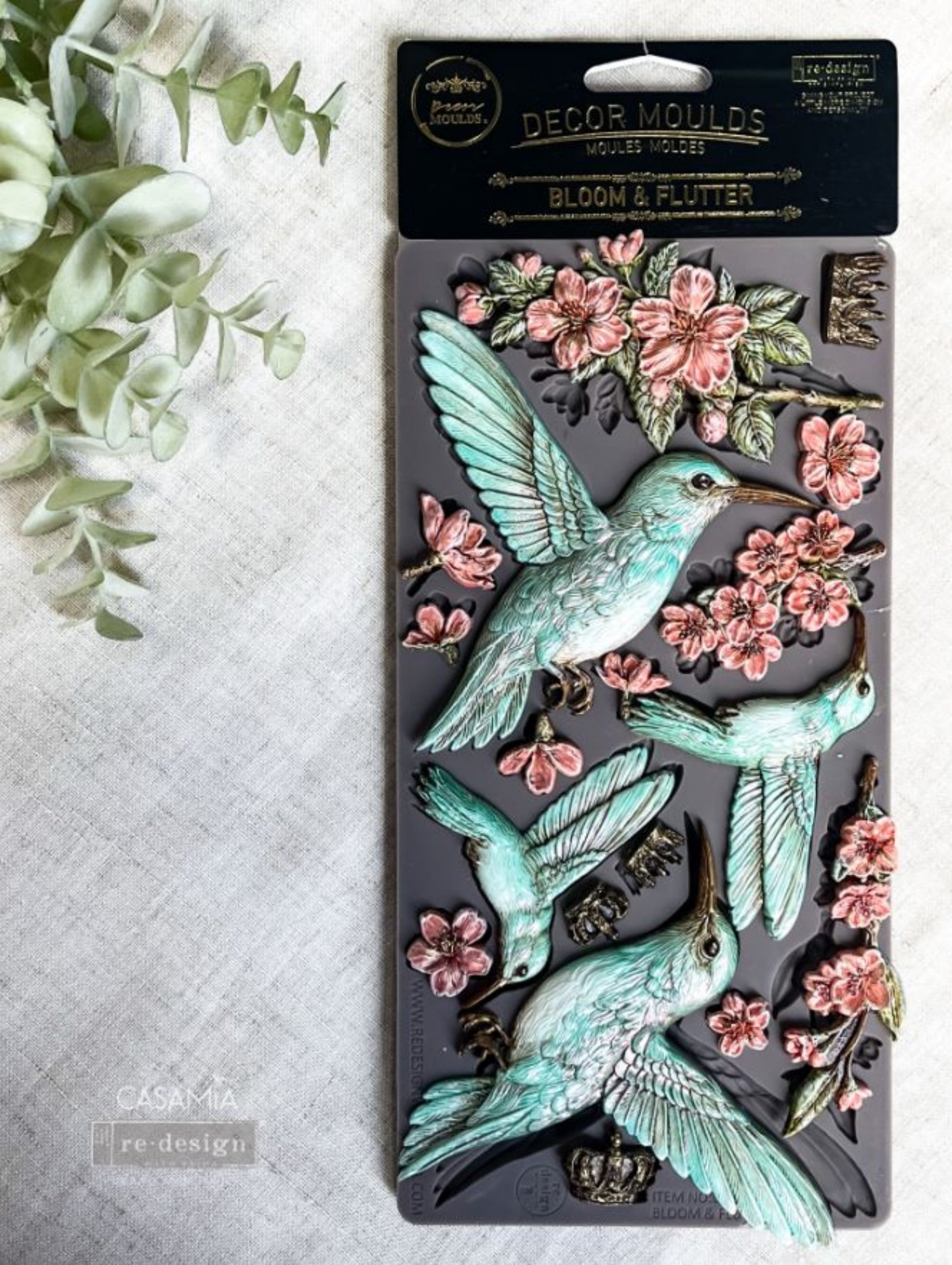 Bloom & Flutter Decor Mould showing raised hummingbirds and floral blossom details for furniture makeovers and craft projects.