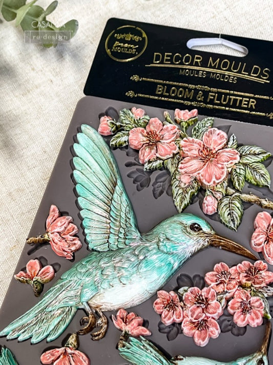 Redesign with Prima Bloom & Flutter silicone decor mould with hummingbirds, blooming branches, flowers, leaves, and crown accents.