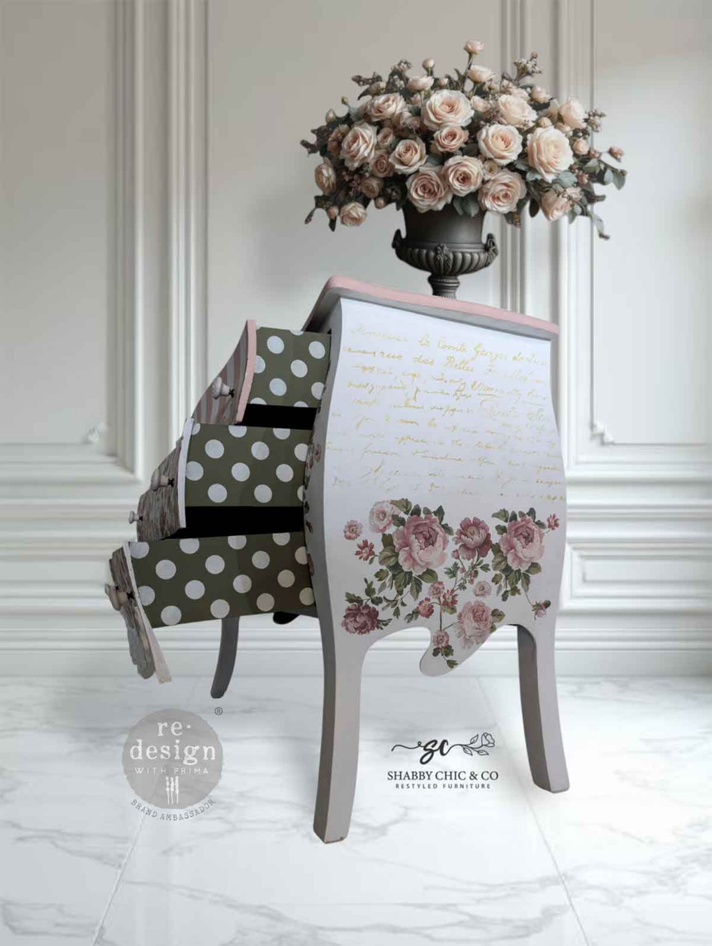 Blushing Blooms Symphony Kacha Decor Transfer applied to the side of a white vintage dresser with pink trim, floral accents, and open patterned drawers.