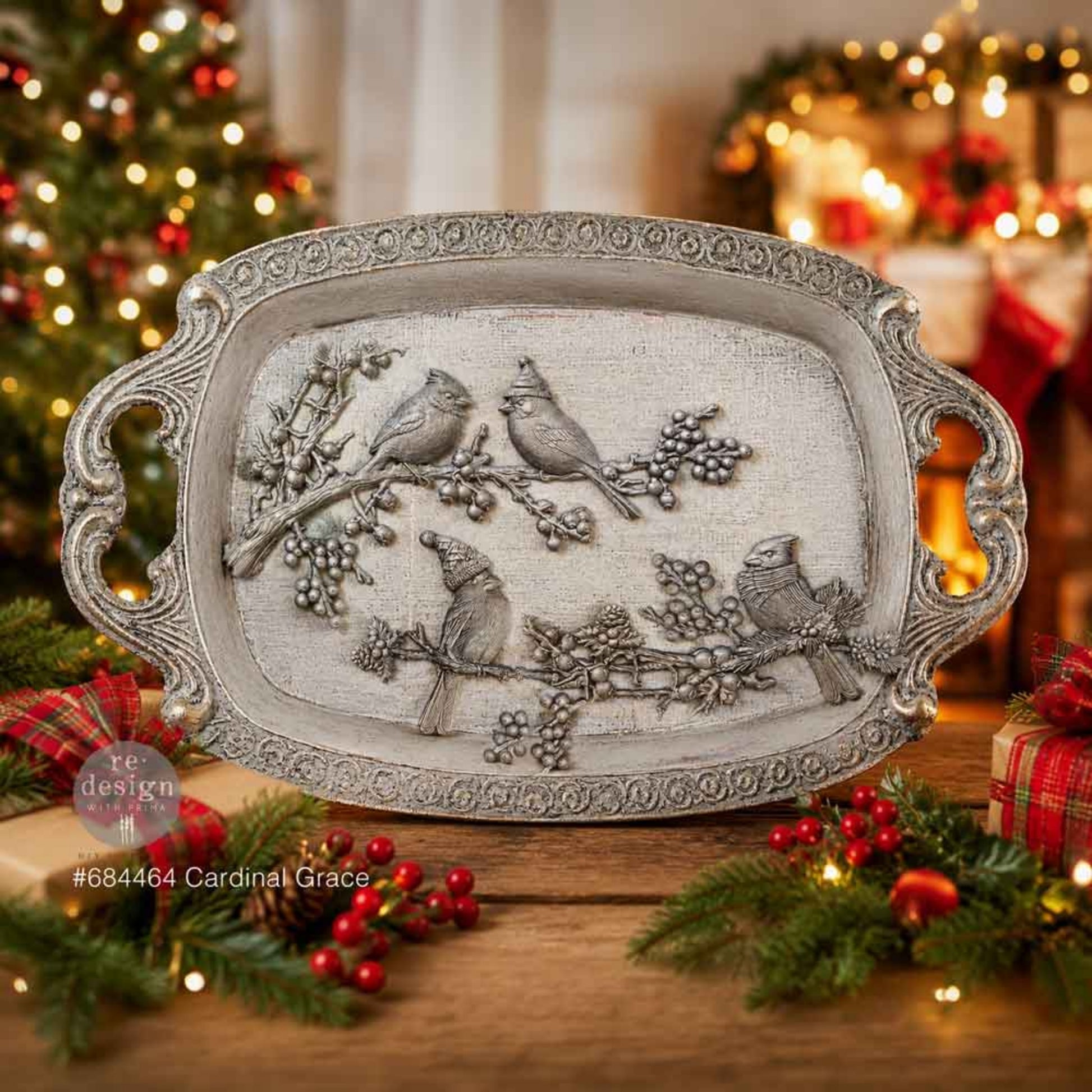Ornate silver tray decorated with Cardinal Grace bird and winter botanical castings in a festive holiday setting.