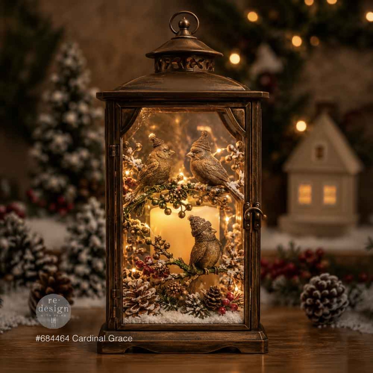 Lighted Christmas lantern decorated with gold Cardinal Grace birds, branches, berries, pinecones, and winter greenery.