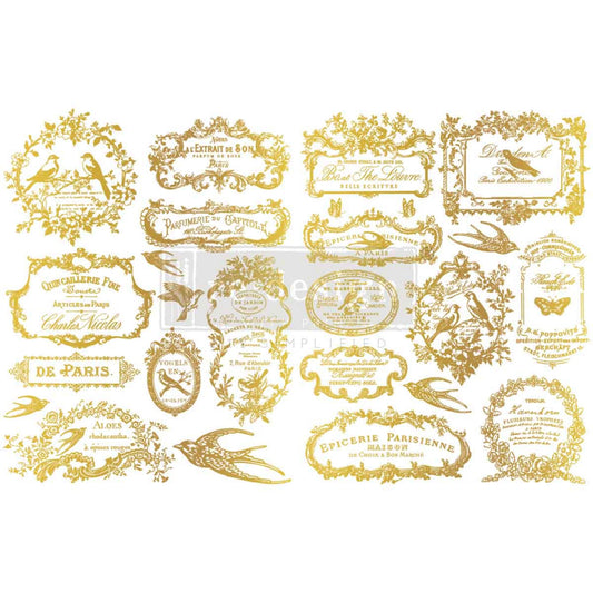 Chant Du Matin gold H2O transfer designs applied to white kitchen canisters for a vintage French bakery-inspired décor look.