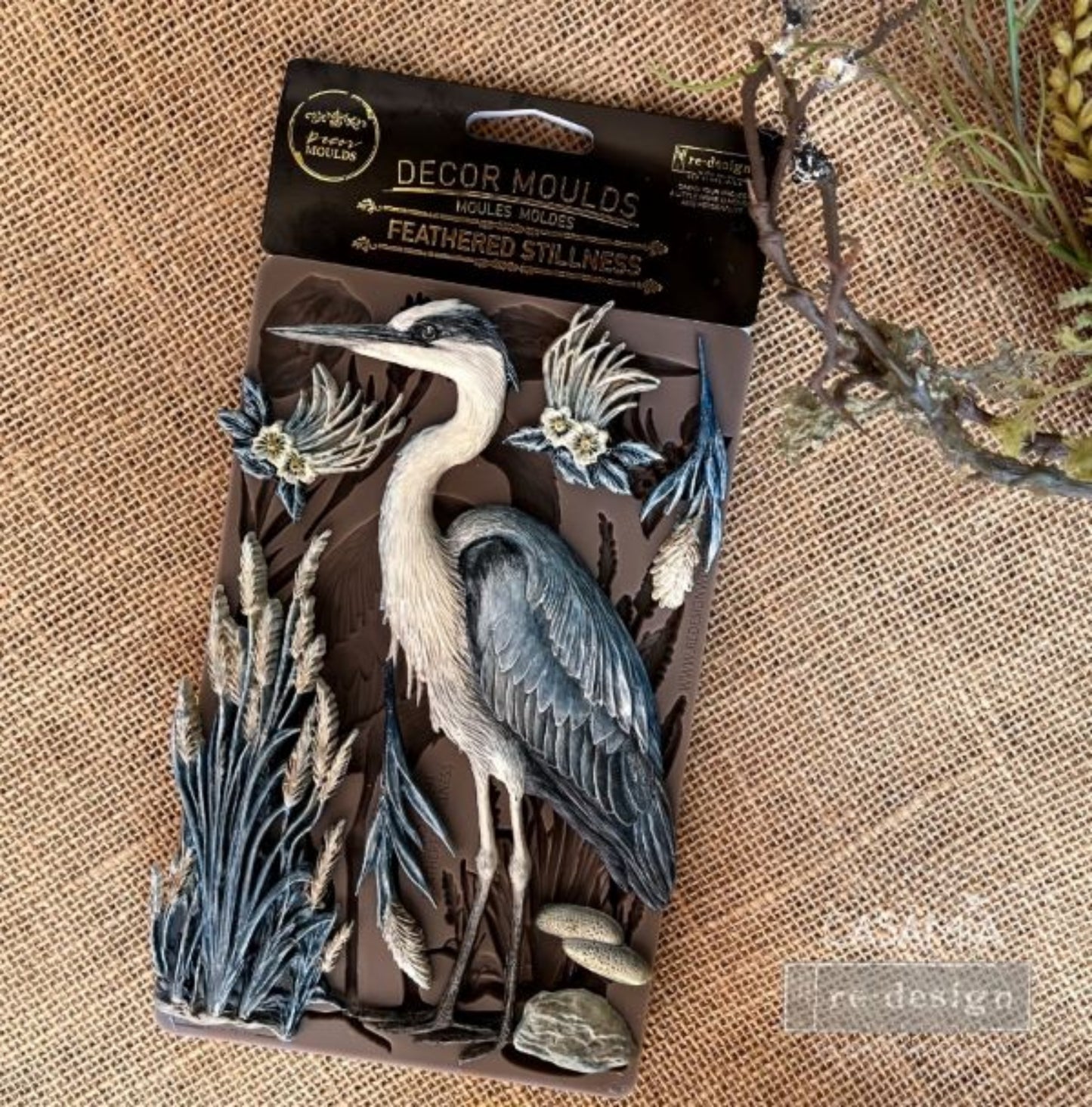 Redesign with Prima Feathered Stillness silicone decor mould with heron-style bird, cattails, water grasses, flowers, leaves, and nature-inspired details.