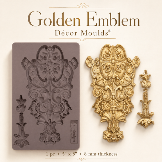 Golden Emblem Decor Mould featuring an ornate raised emblem design with scrollwork, floral details, and coordinating accent piece.