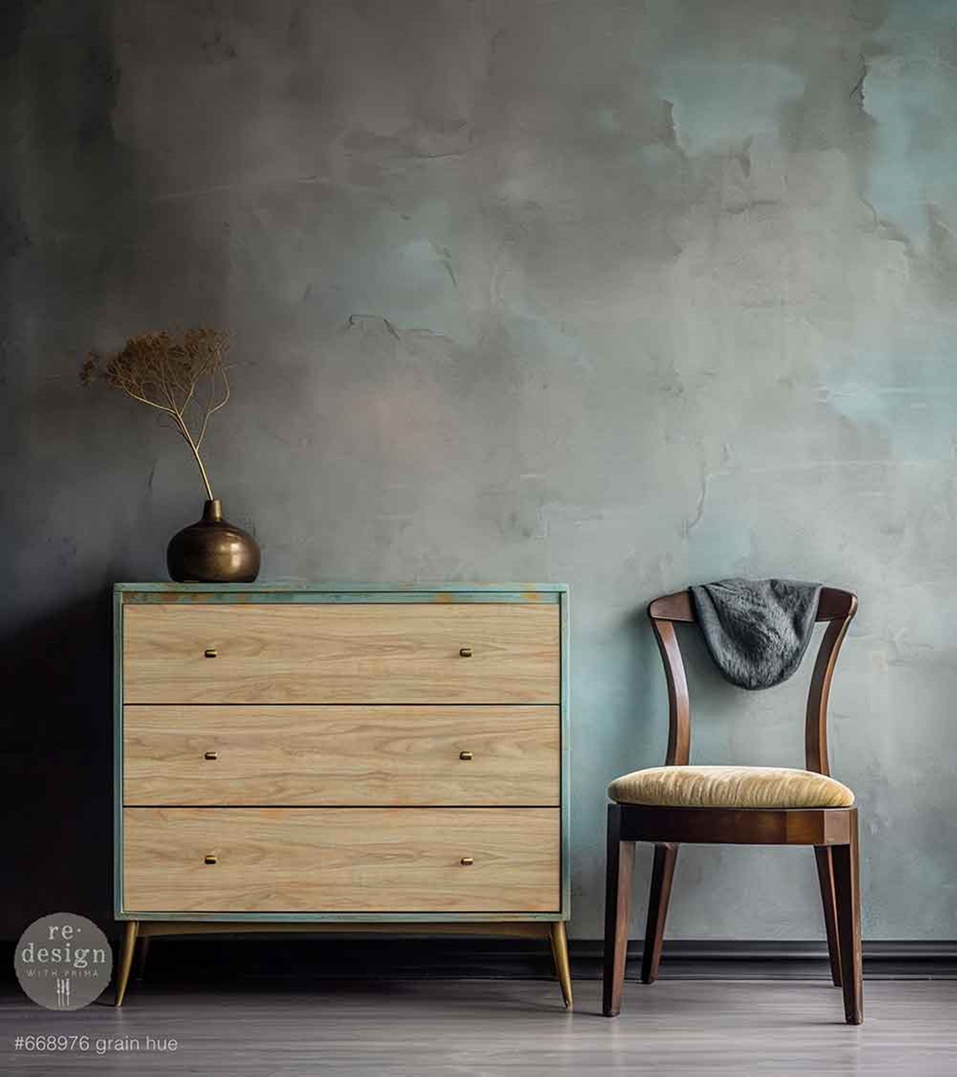 Grain Hue wood-grain decoupage fiber paper used on a three-drawer dresser with a softly distressed aqua frame and minimalist brass knobs.