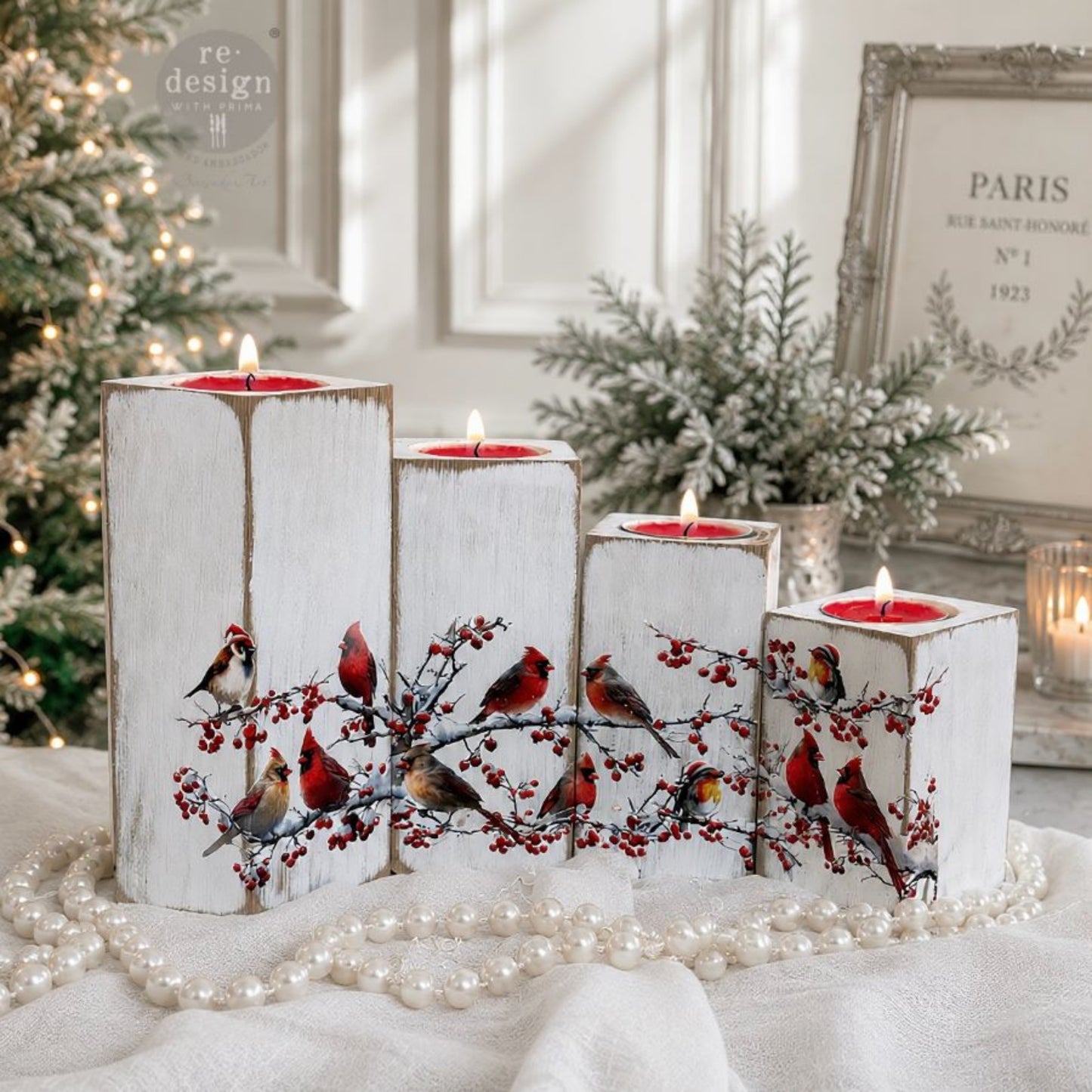 Hollywing Cardinal bird transfers applied to white candle holders for a festive winter woodland look