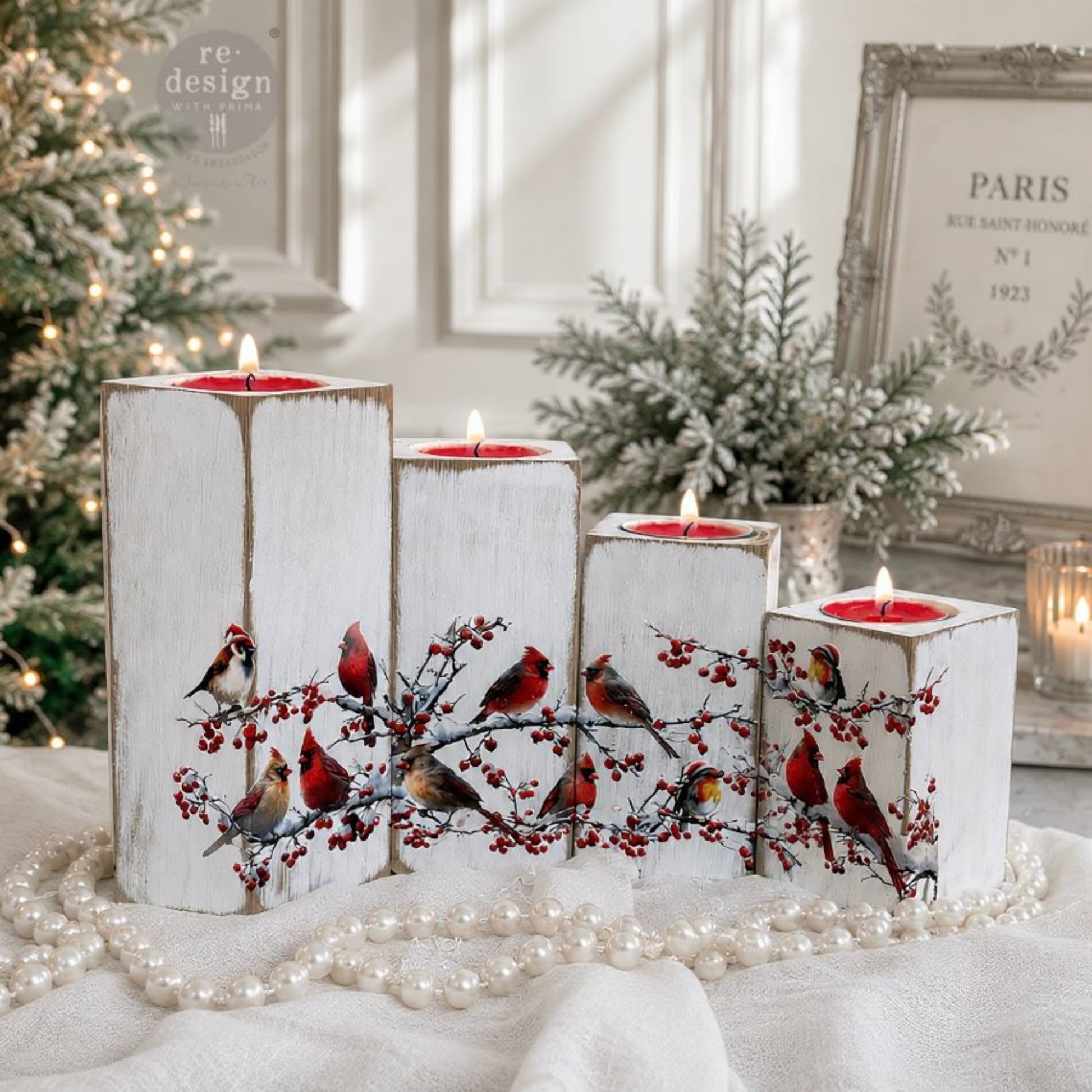 Hollywing Cardinal bird transfers applied to white candle holders for a festive winter woodland look