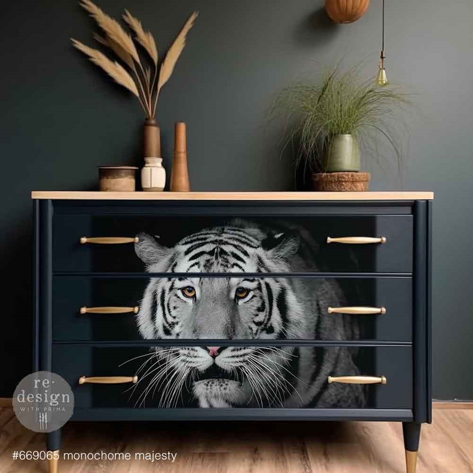Monochrome Majesty decoupage fiber paper applied across the front of a black three-drawer dresser, featuring a dramatic white tiger with golden eyes and brass hardware.