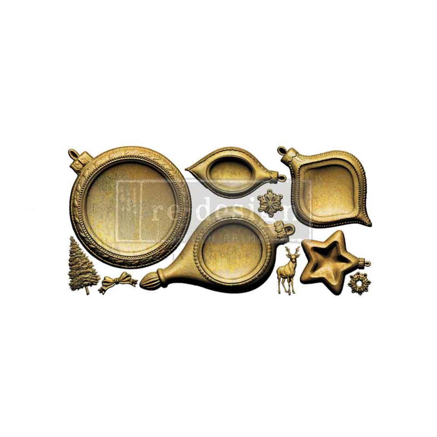 Hand holding a large round ornament frame casting from the Noel Elegance mould, with additional moulded pieces in the background.