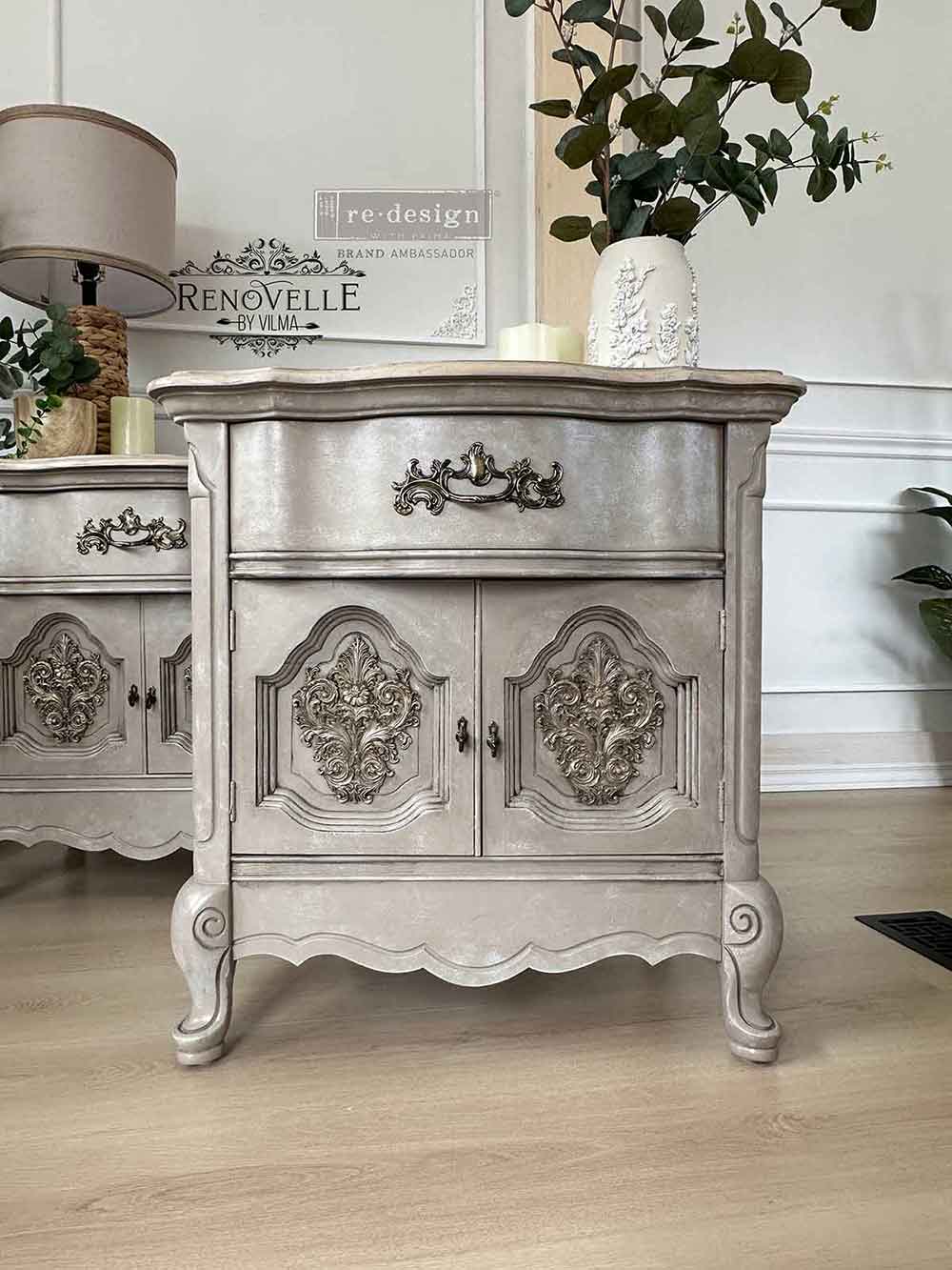 Salon De La Belle Epoque Decor Mould castings applied to gray painted cabinet doors, adding ornate raised scrollwork, French vintage detail, and elegant furniture accents.
