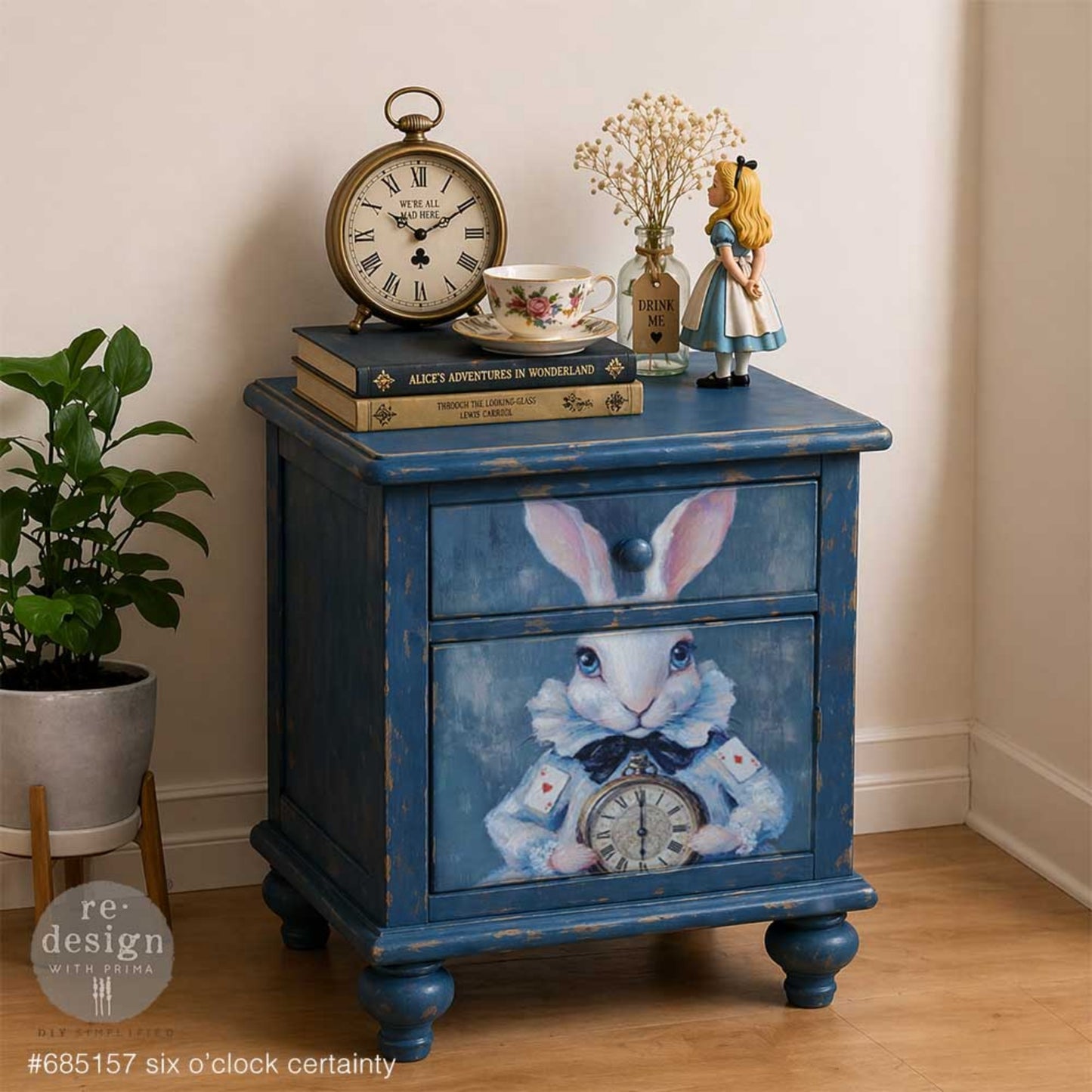 Blue painted nightstand makeover featuring the Six O’Clock Certainty white rabbit and pocket watch design.
