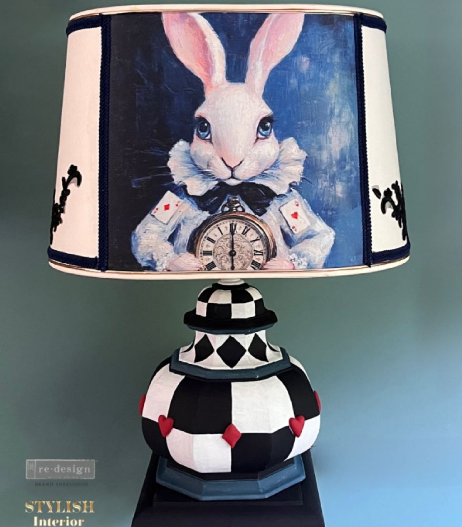 Six O’Clock Certainty rabbit artwork applied to a decorative lampshade on a black and white checked lamp base.