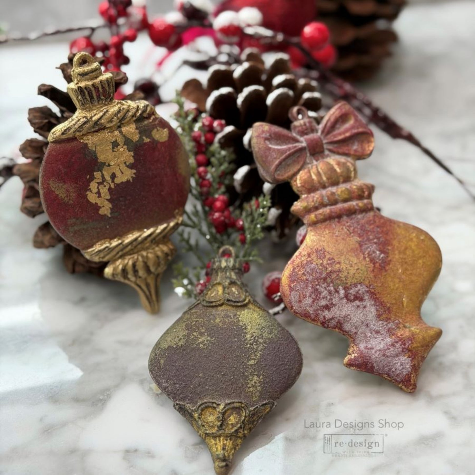 Four handmade Winter Luxe Blanks ornaments displayed on a small Christmas tree with muted green, gold, blush, and vintage holiday details.