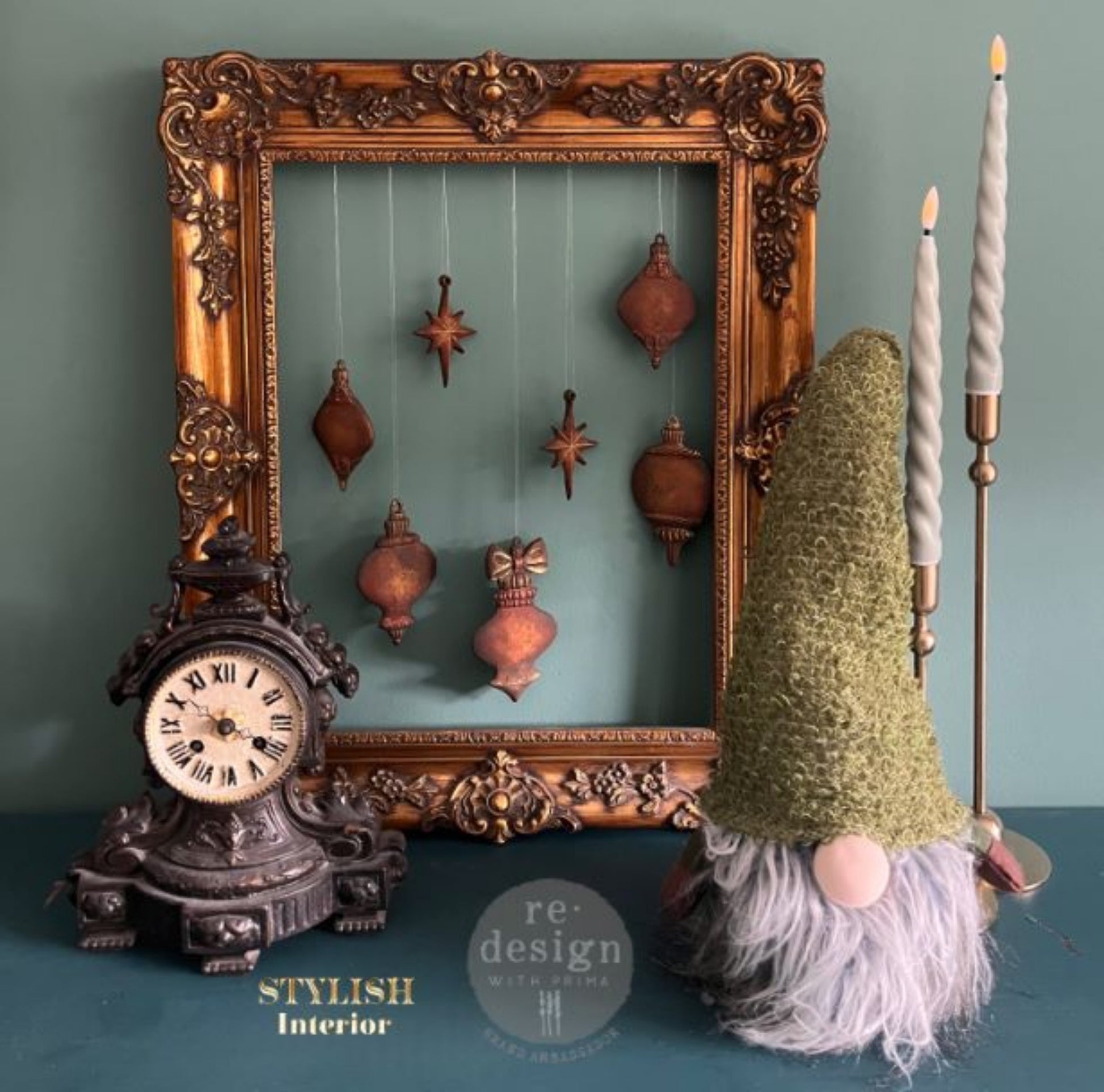 Winter Luxe Blanks silicone mould with cast ornament shapes painted in aged bronze and arranged with autumn leaves and dried flowers.