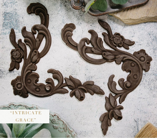 Intricate Grace Décor Poly® set featuring two ornate floral scroll appliqués with elegant curved details, ideal for furniture makeovers, cabinets, frames, and vintage-inspired décor.
